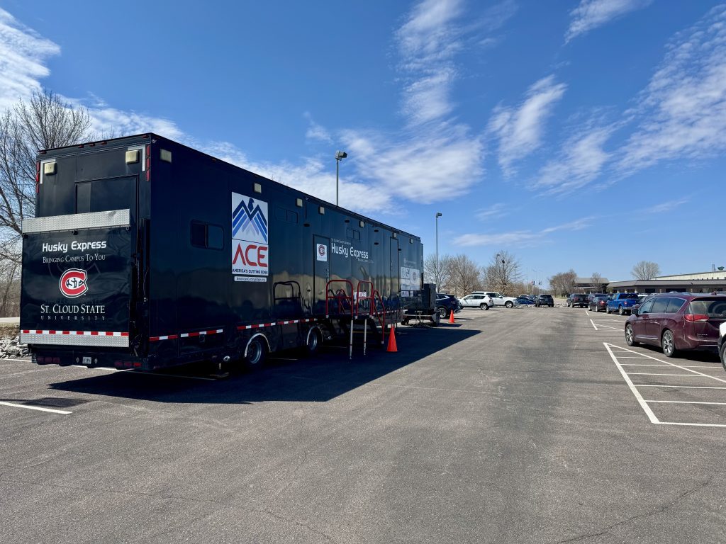 The St. Cloud State University ACE mobile trailer sits in the Coldspring parking lot for an April 2025 bootcamp.