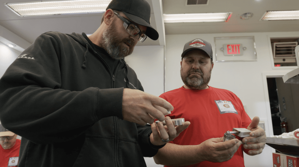 Two Coldspring employees examine the ACE air engine.