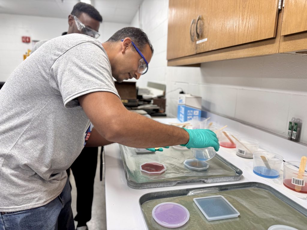 Samir Bera works on casting resins during the bootcamp