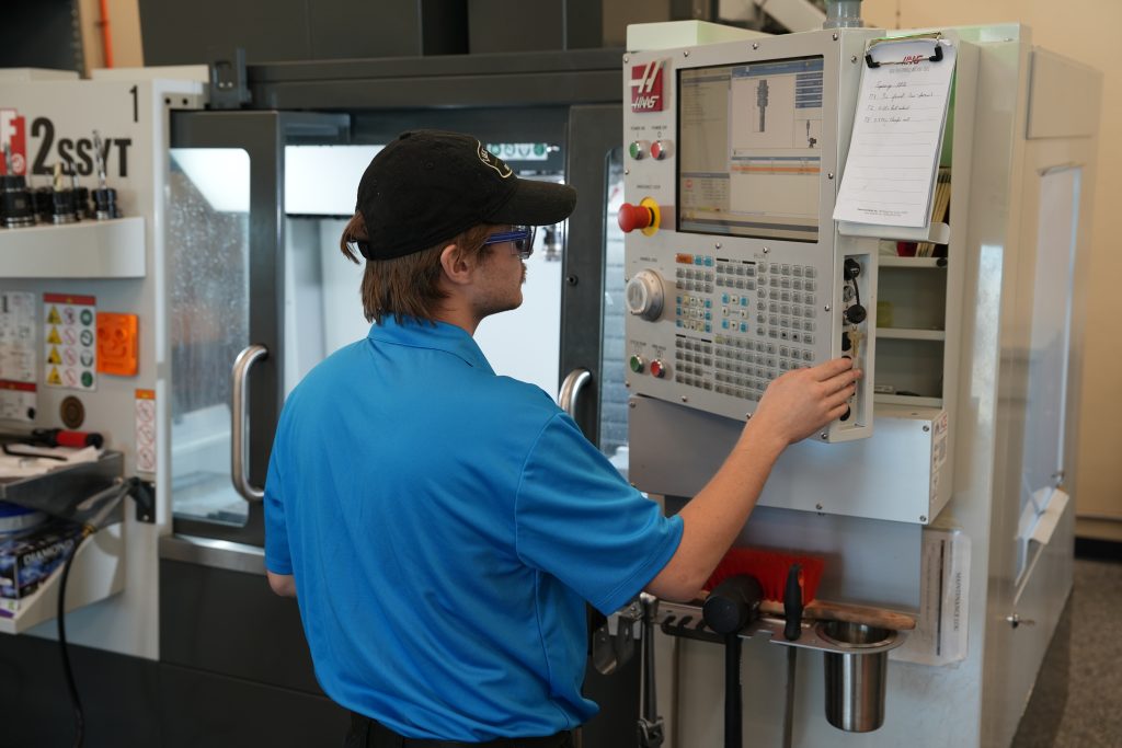 Charles Sipe works on a CNC machine