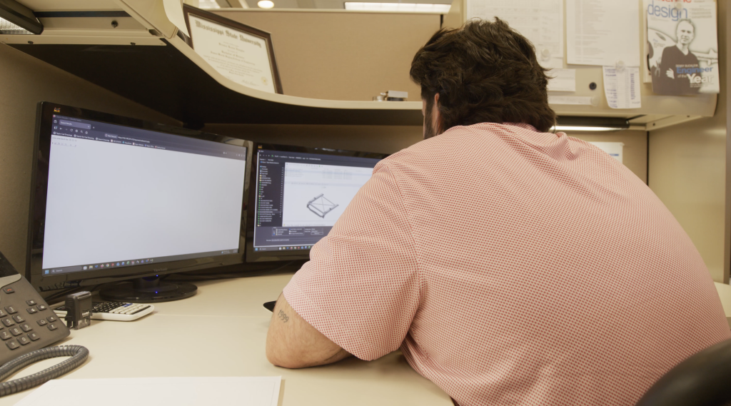 Brewer Vaughn works on a computer
